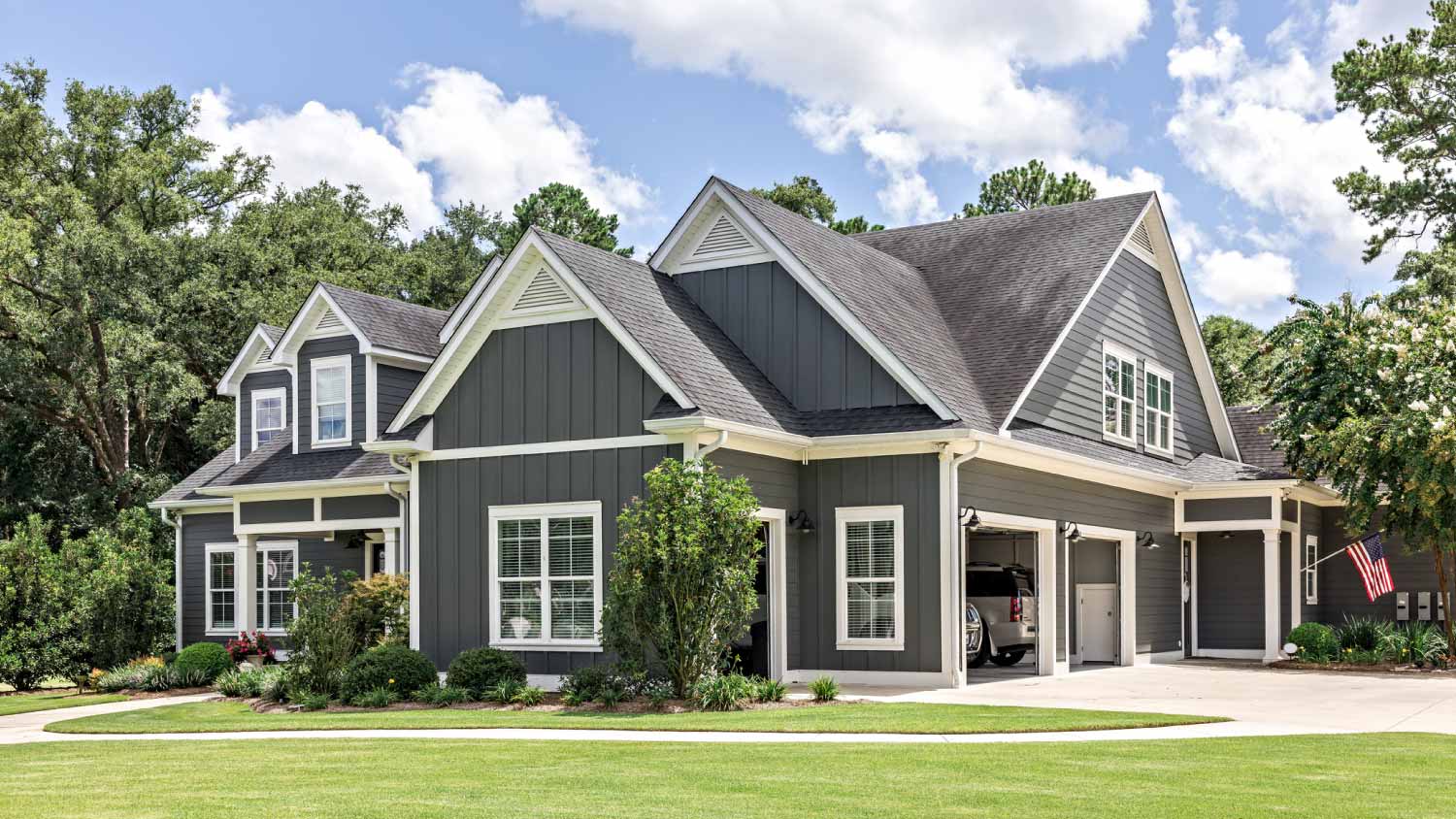 Large gray craftsman new construction house