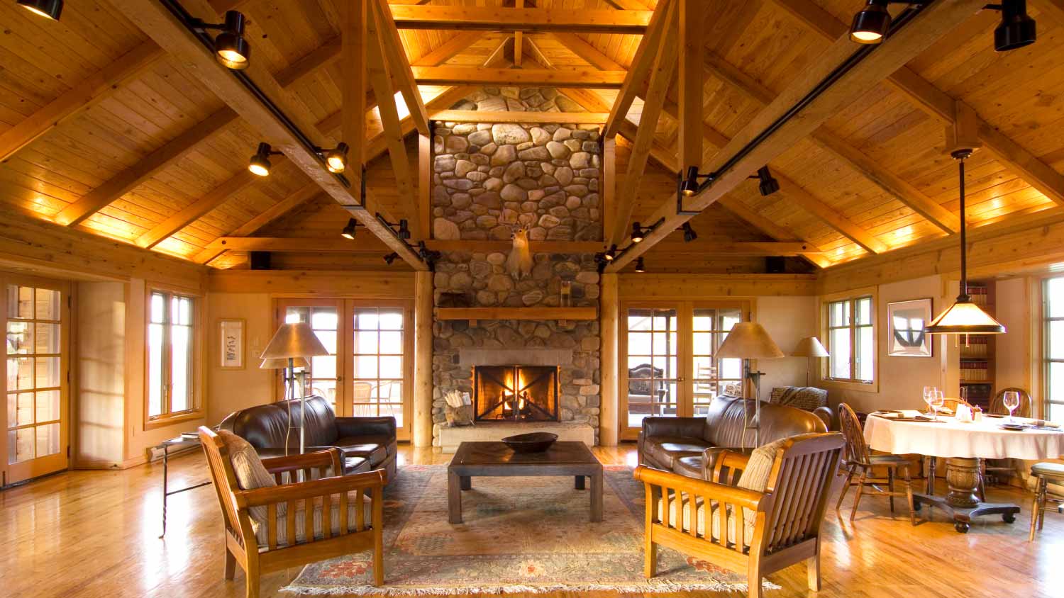 Living room and stone fireplace in cabin 