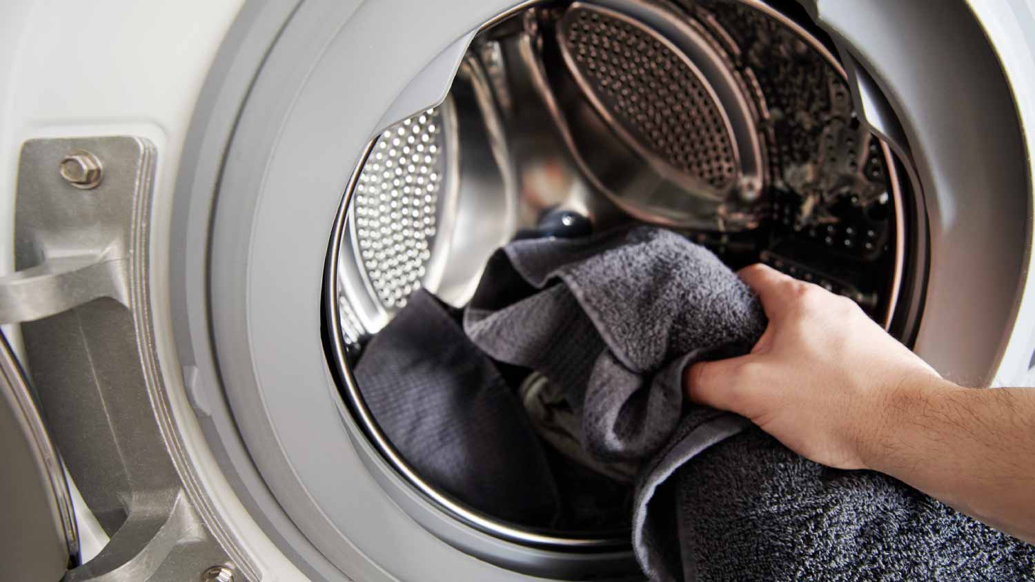 Loading dirty cloth in washing machine