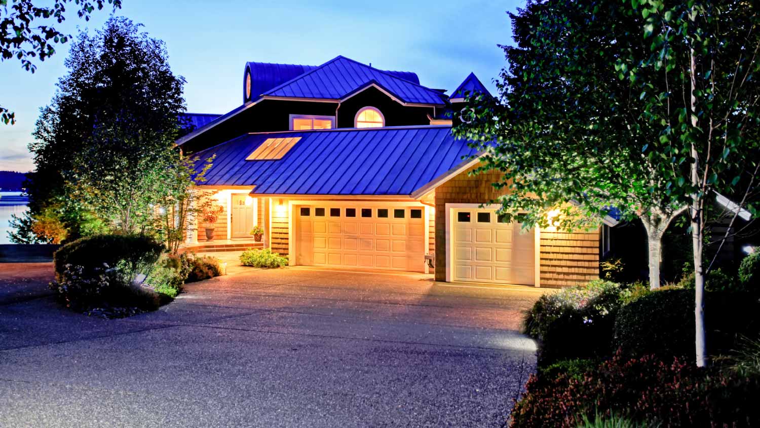 Luxury house blue roof with tar and chip driveway