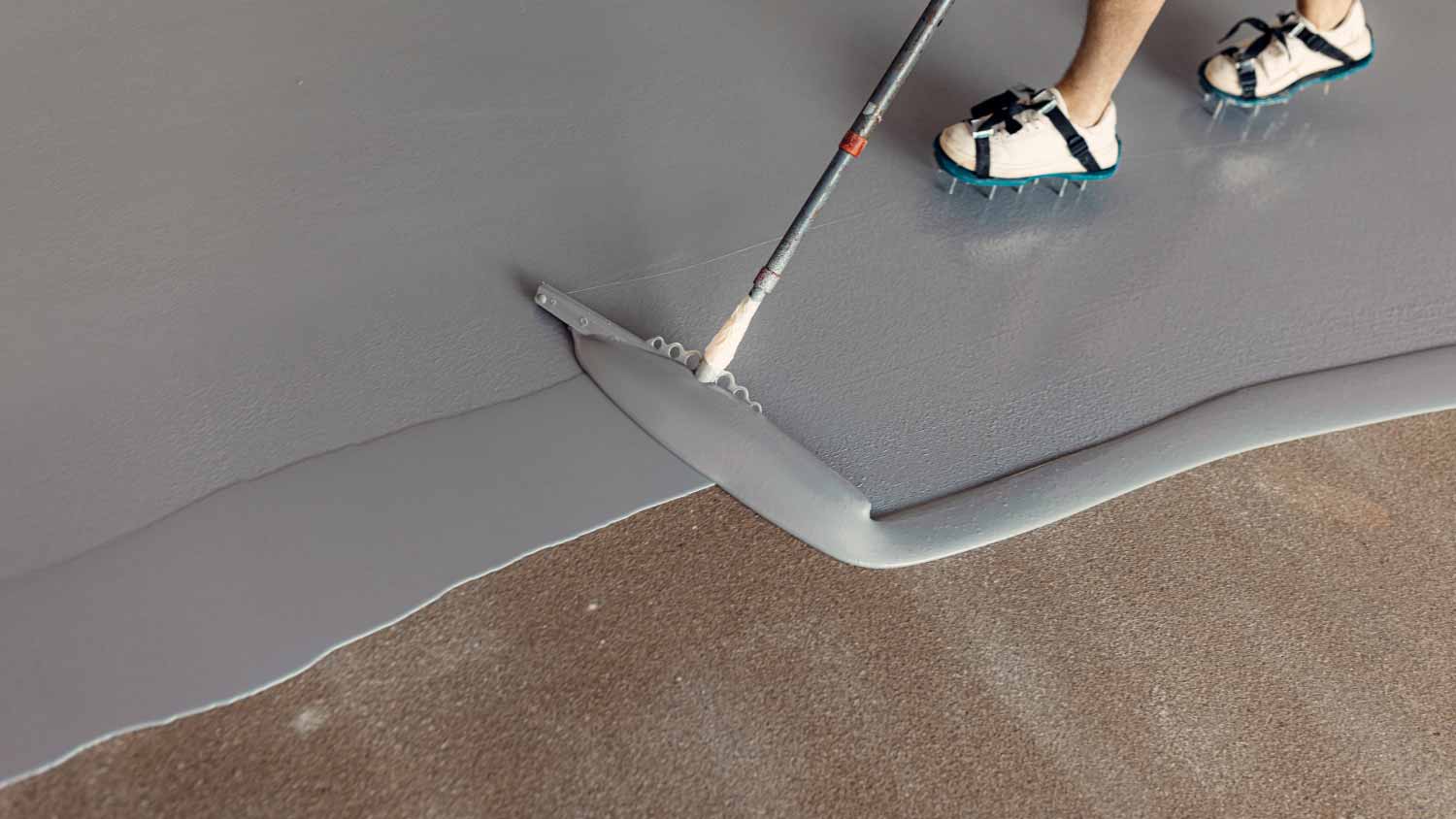 Man applying gray epoxy