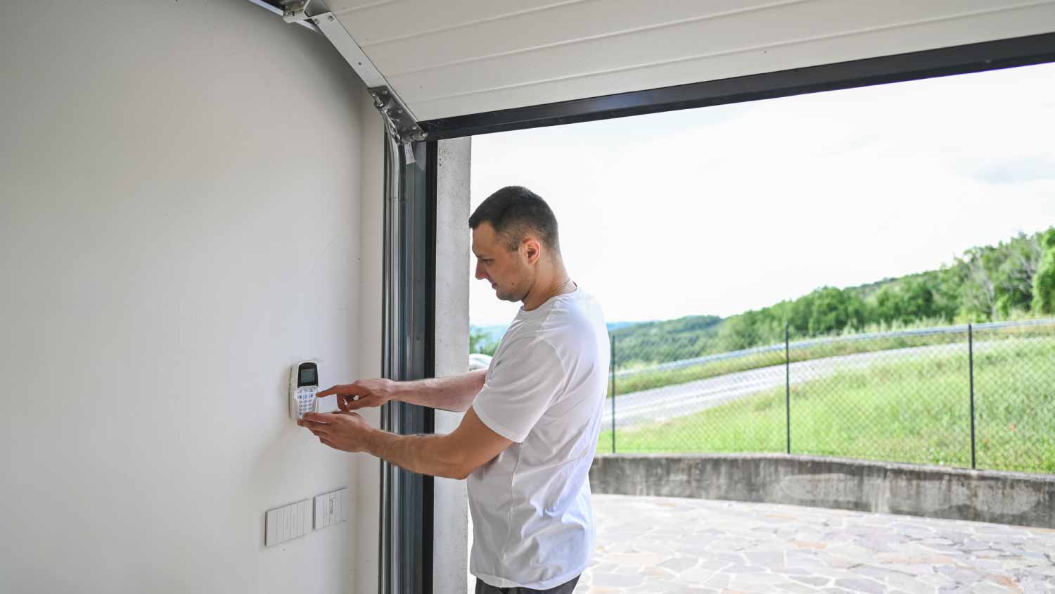 Man closing garage door 