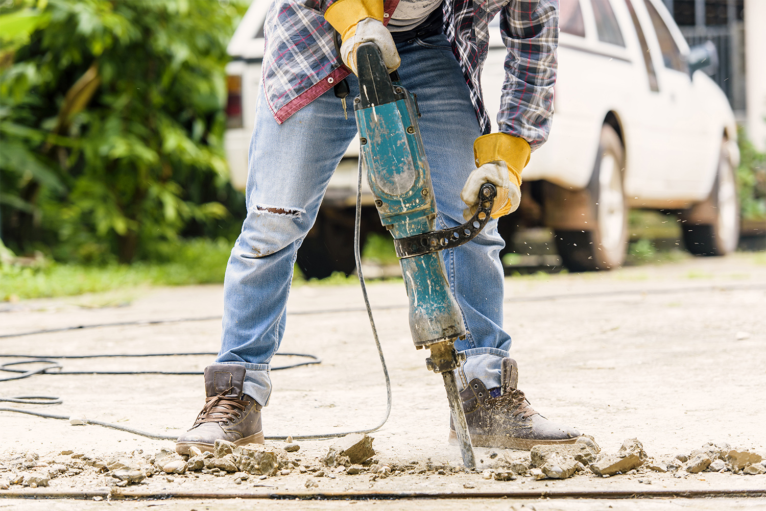 Professional demolishing concrete driveway