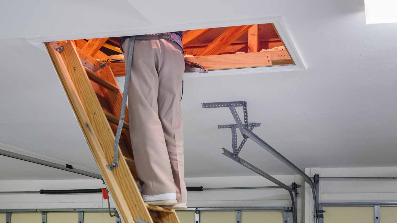 Man inspecting garage attic