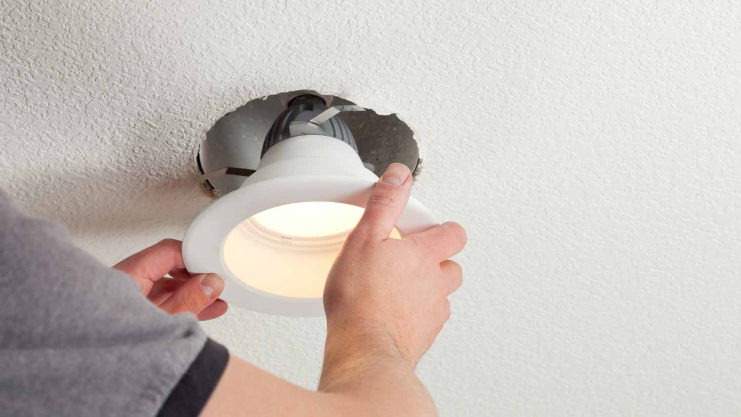 Man installing LED Bulb