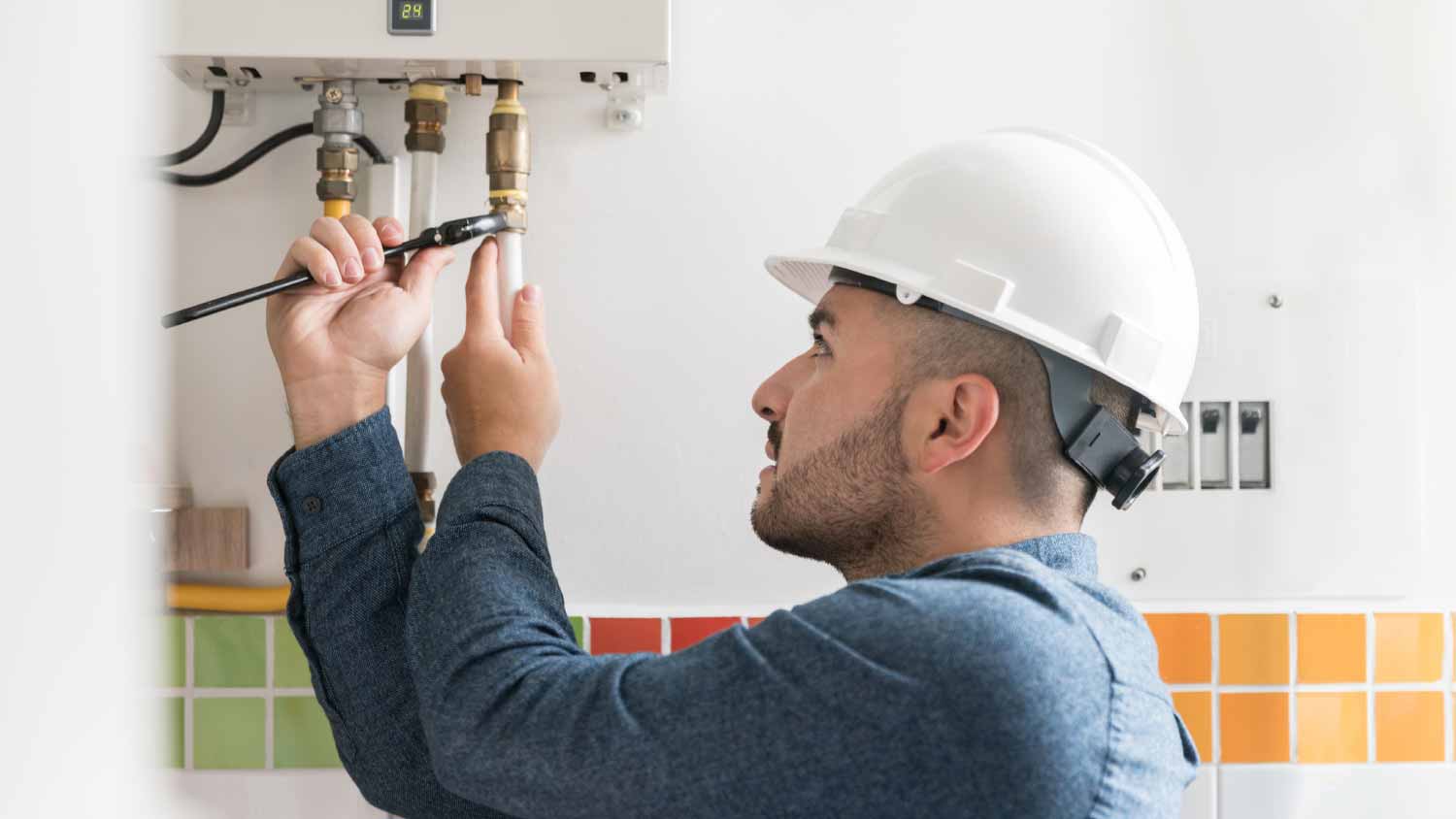 Man installing a natural gas boiler