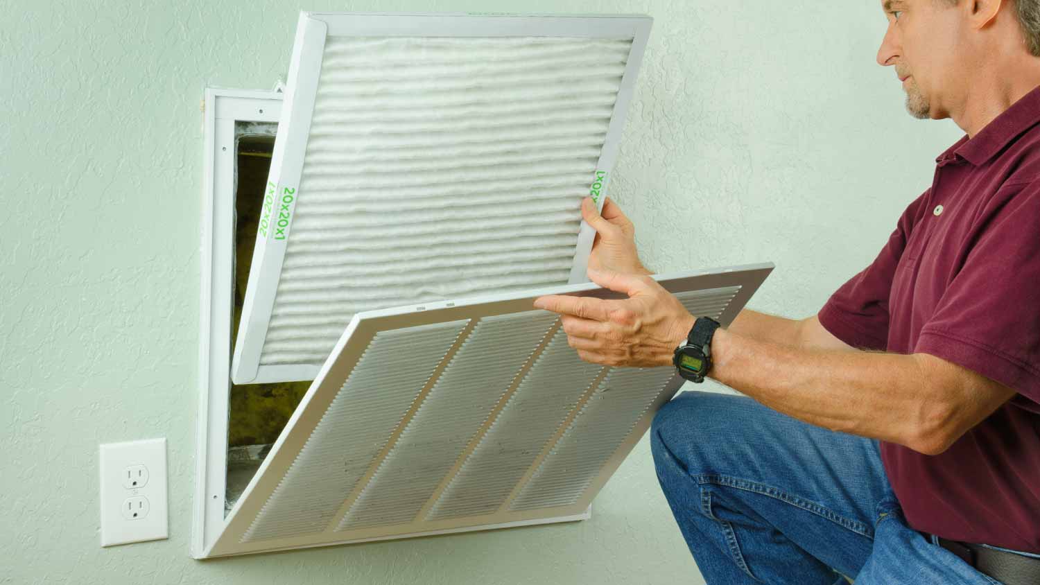 Man installing new air filter