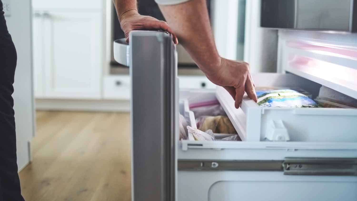 Man opening a freezer