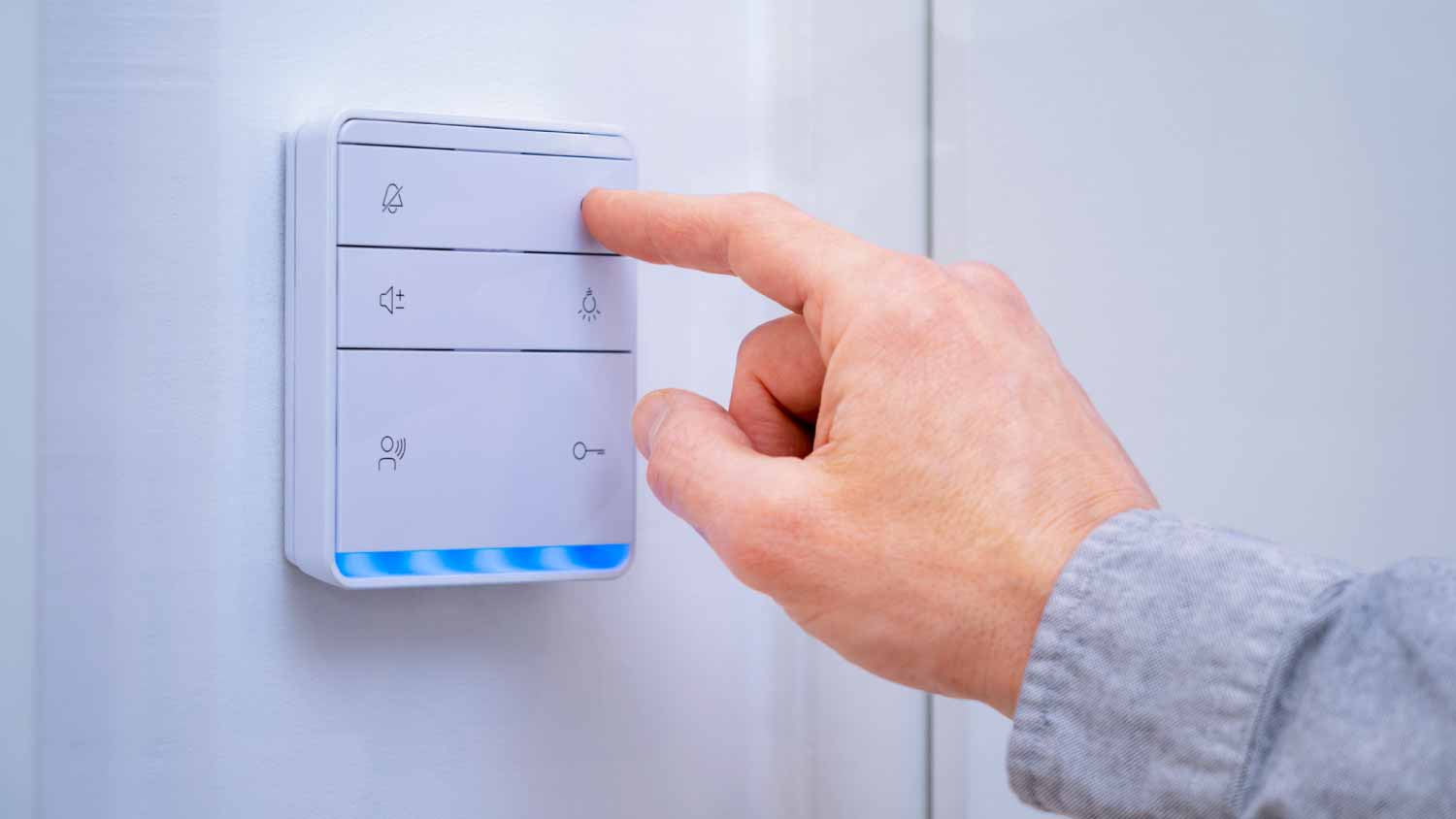 Man pressing the button of a smart home hub