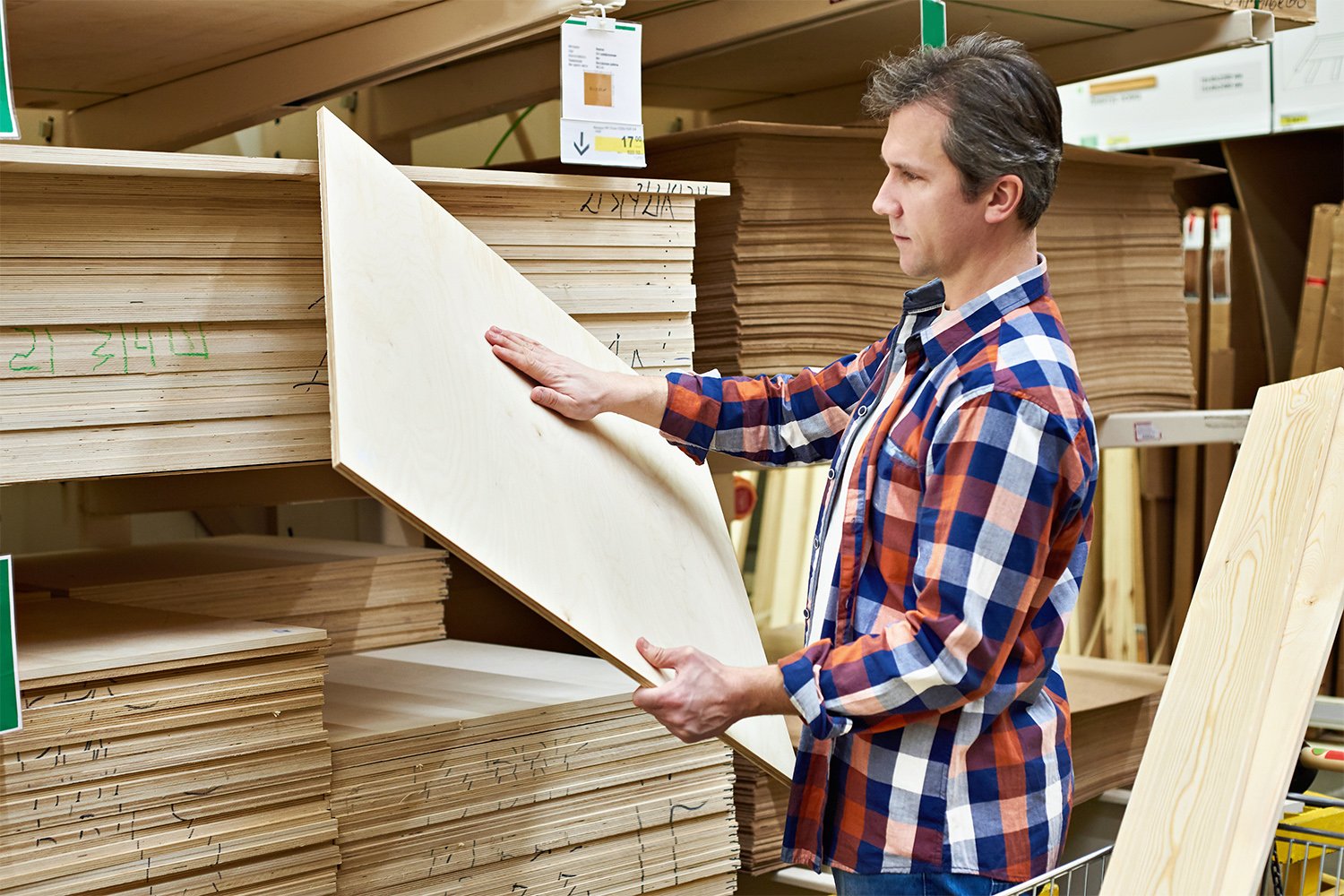 Man purchasing plywood to retrofit 