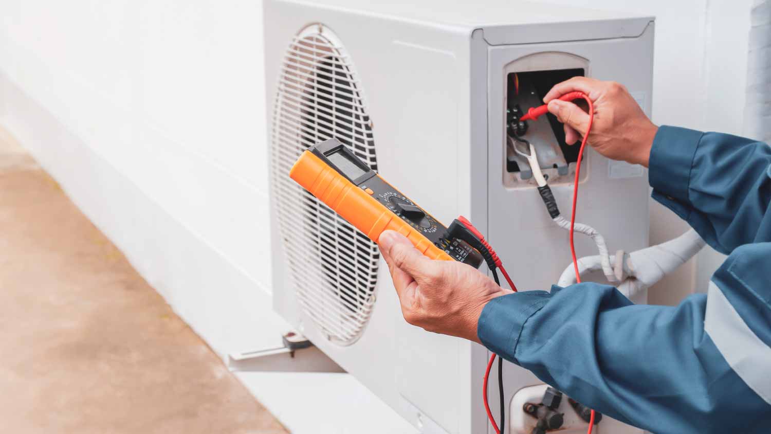 Man repairing central air conditioning system