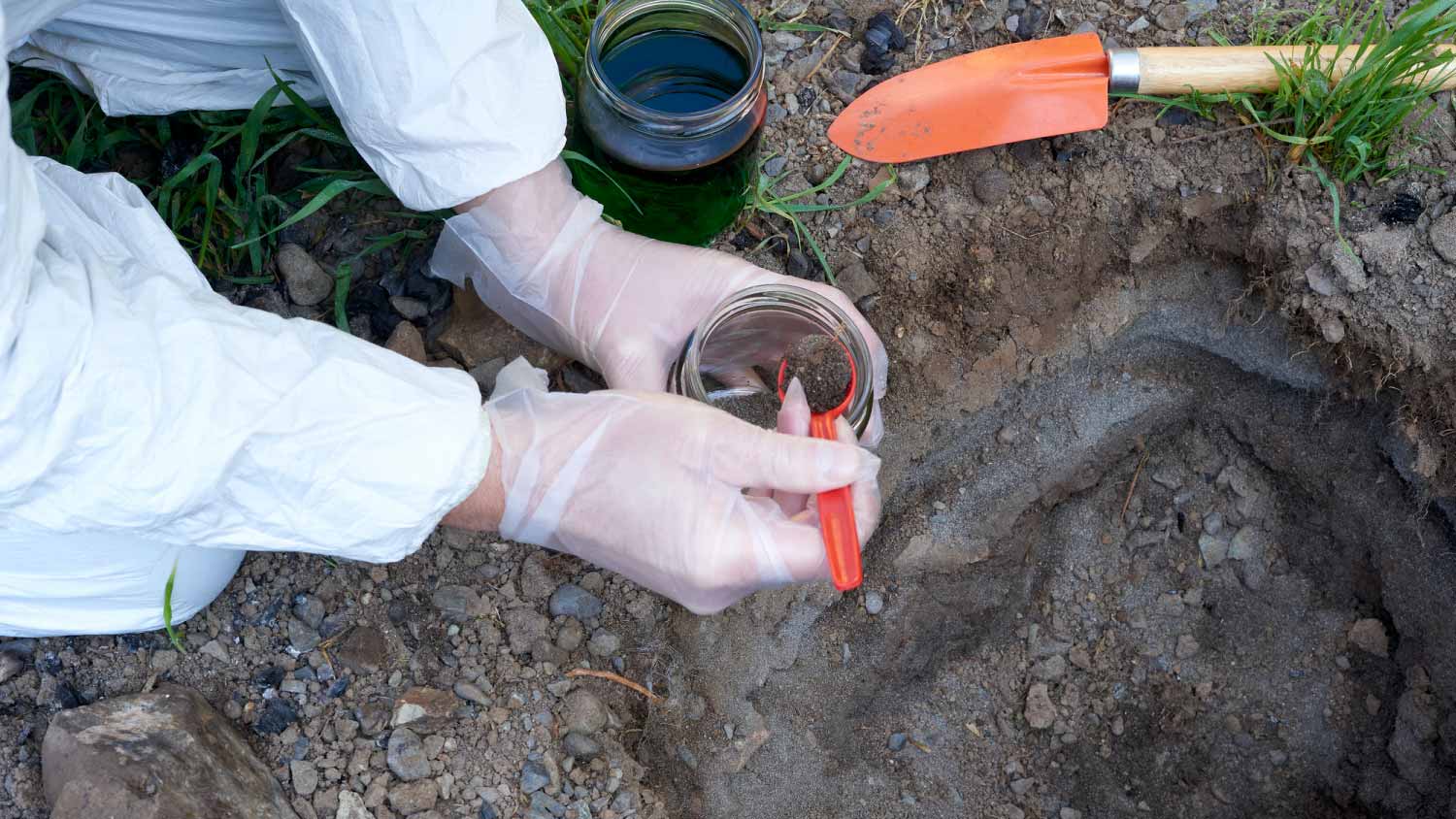 Man taking samples for soil analysis