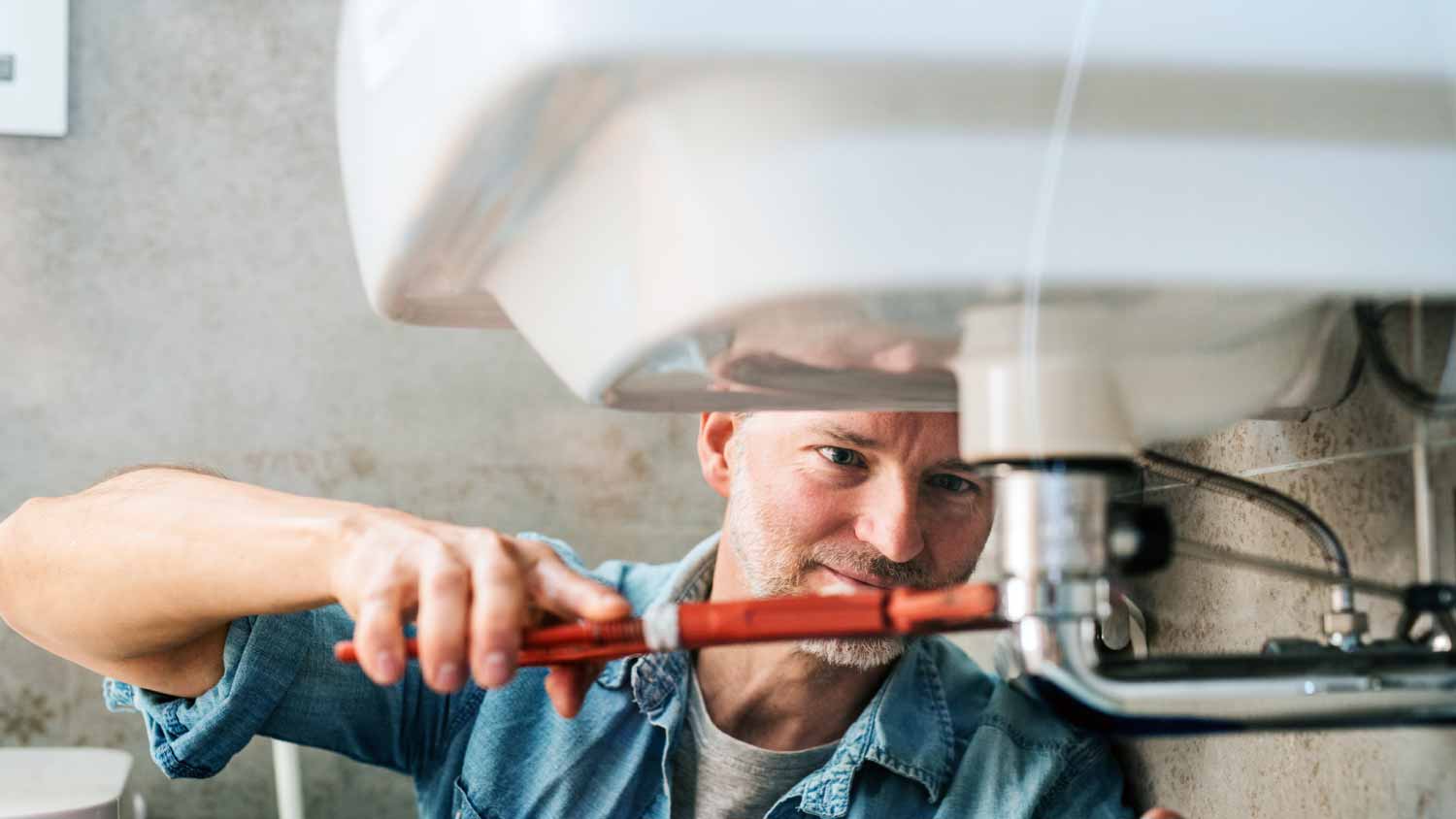 Man trying to fix a leak