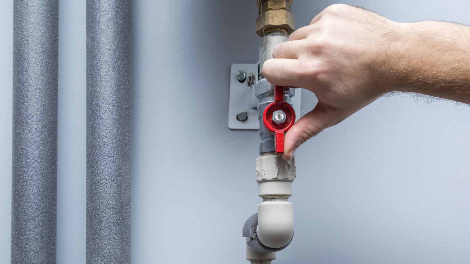 Man turning on water supply