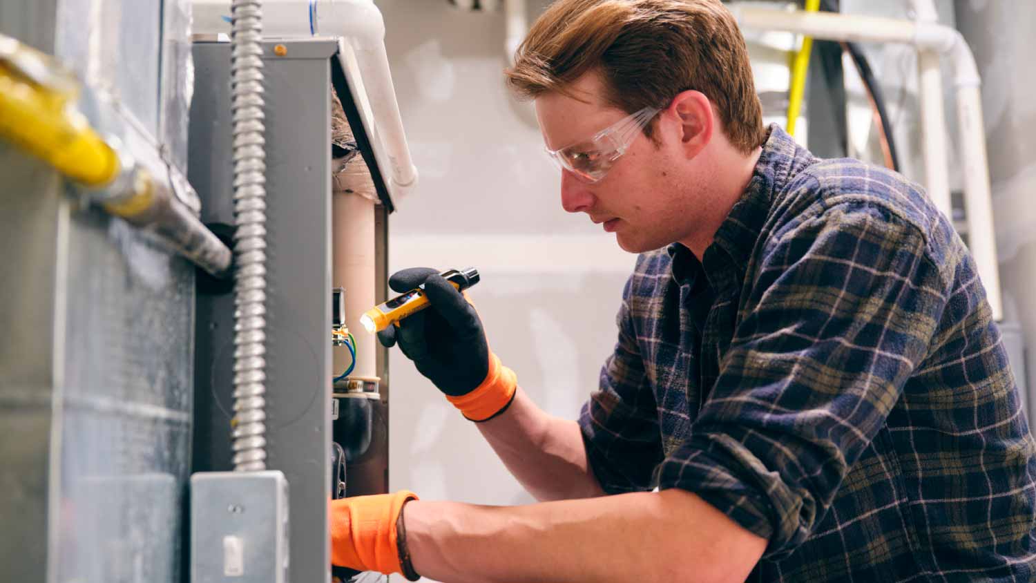 Man working on a furnace