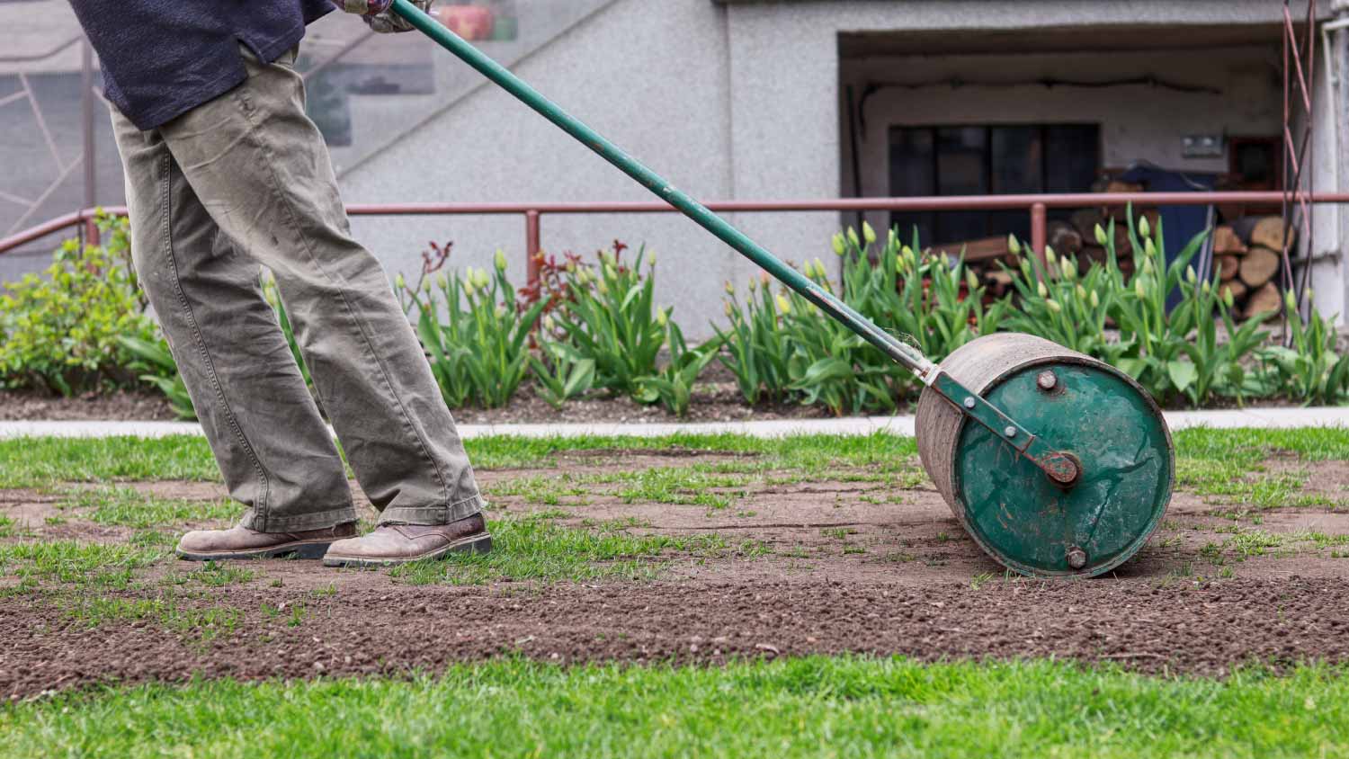 Man working with a lawn roller