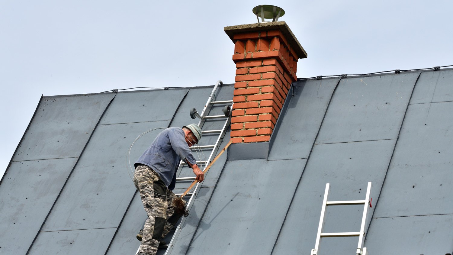 Man fixing roof