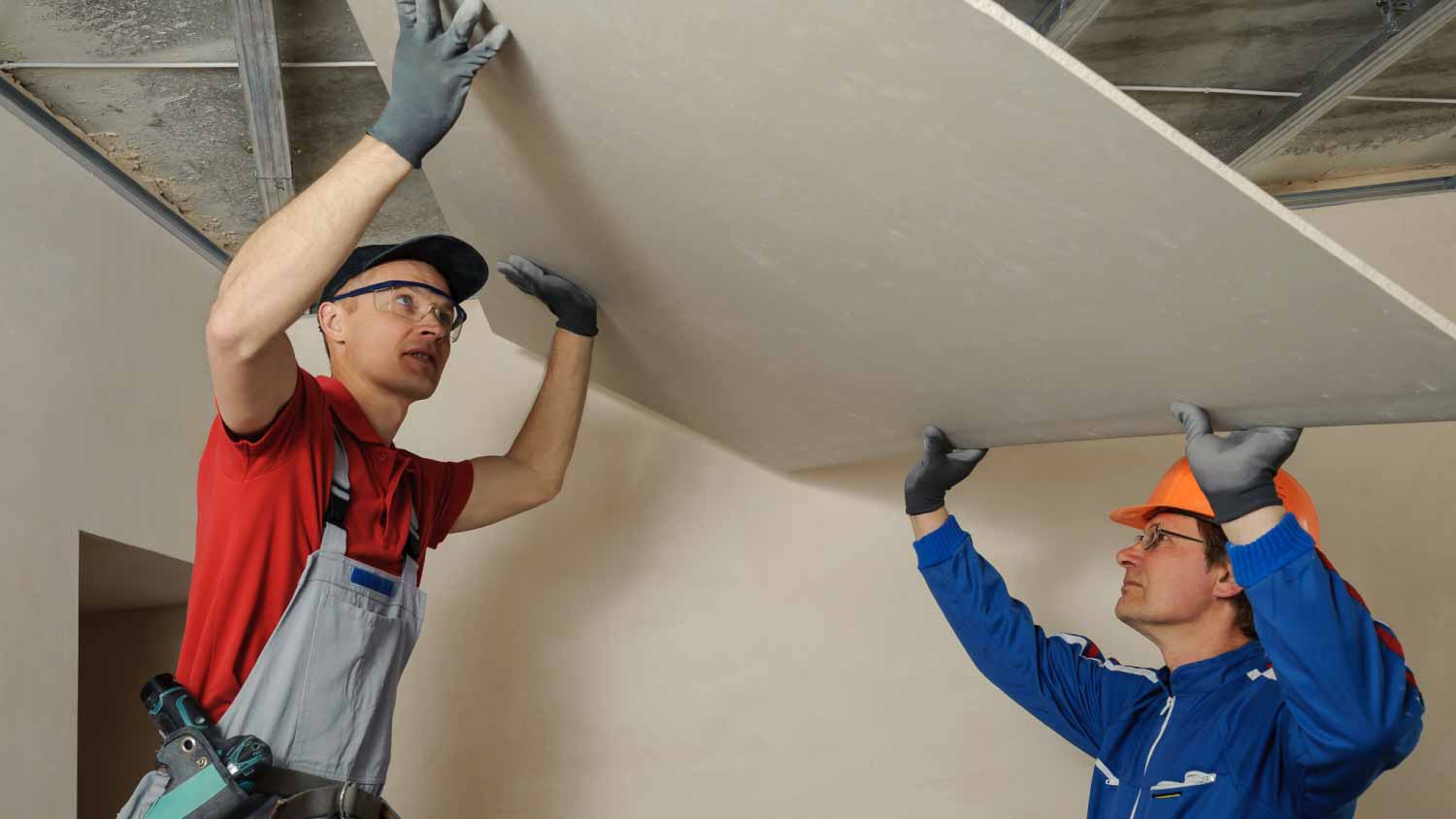 Men holding drywall