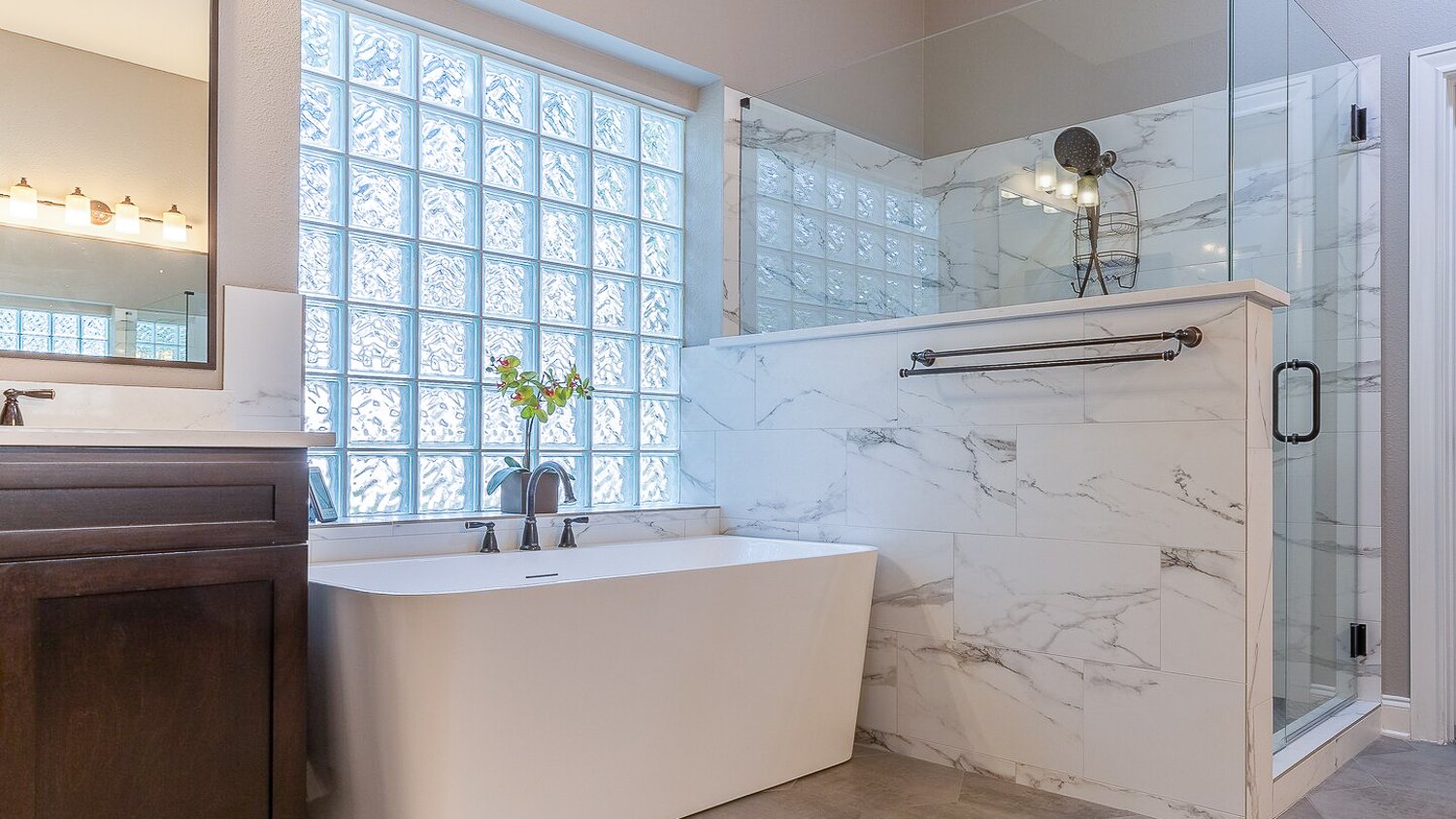 Modern bathroom with glass shower and bathtub