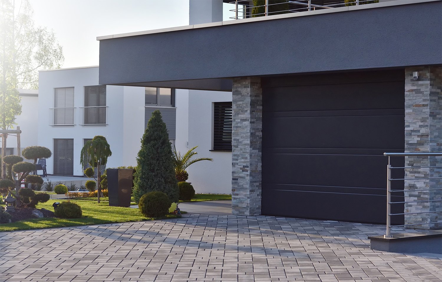 Modern home with a dark color one car garage