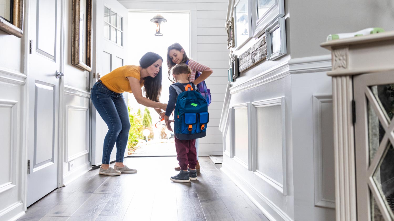 Mother getting children ready for school