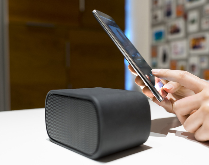 woman holding smart phone to communicate with stereo sound