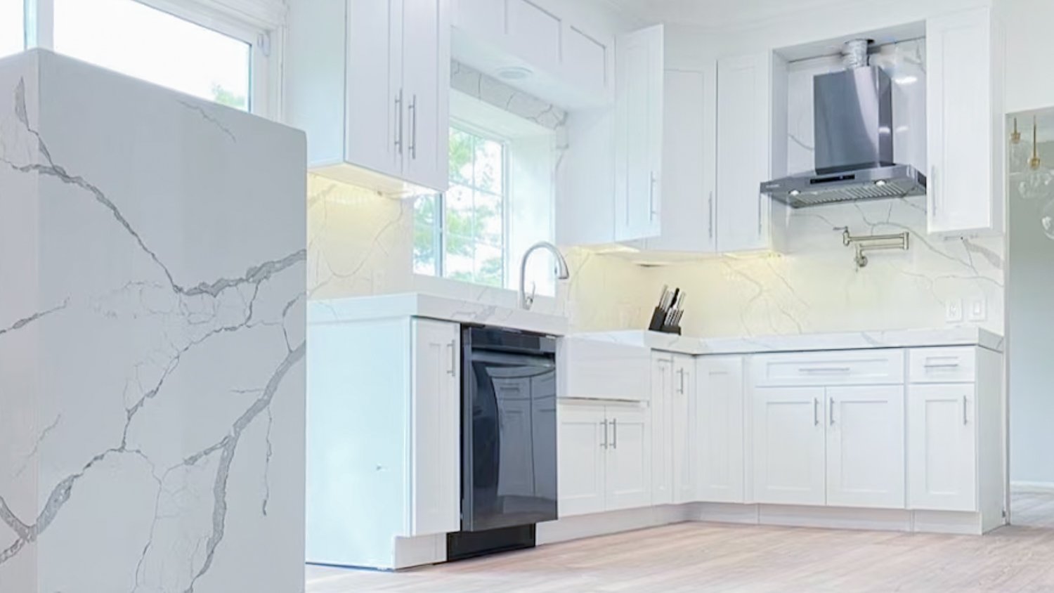 Classic Kitchens & Interiors - A soft taupe-gray stain on the perimeter and  off-white on the island gives this kitchen a coastal feel. The basket weave  tile backsplash goes to the ceiling