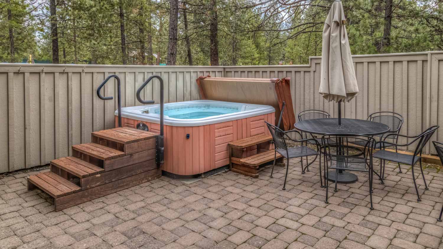 Outdoor hot tub on a backyard patio