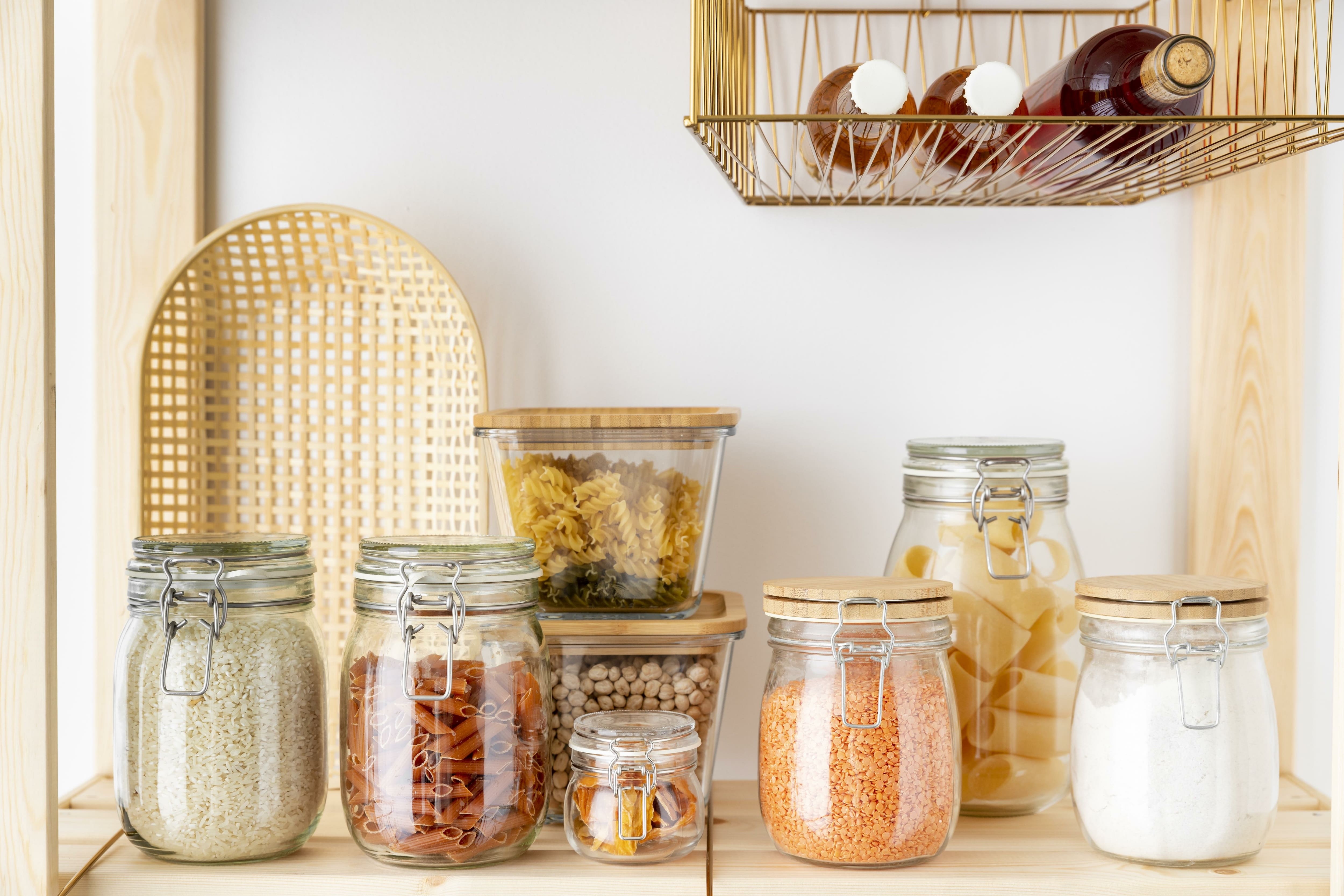 Containers and wire baskets in kitchen pantry