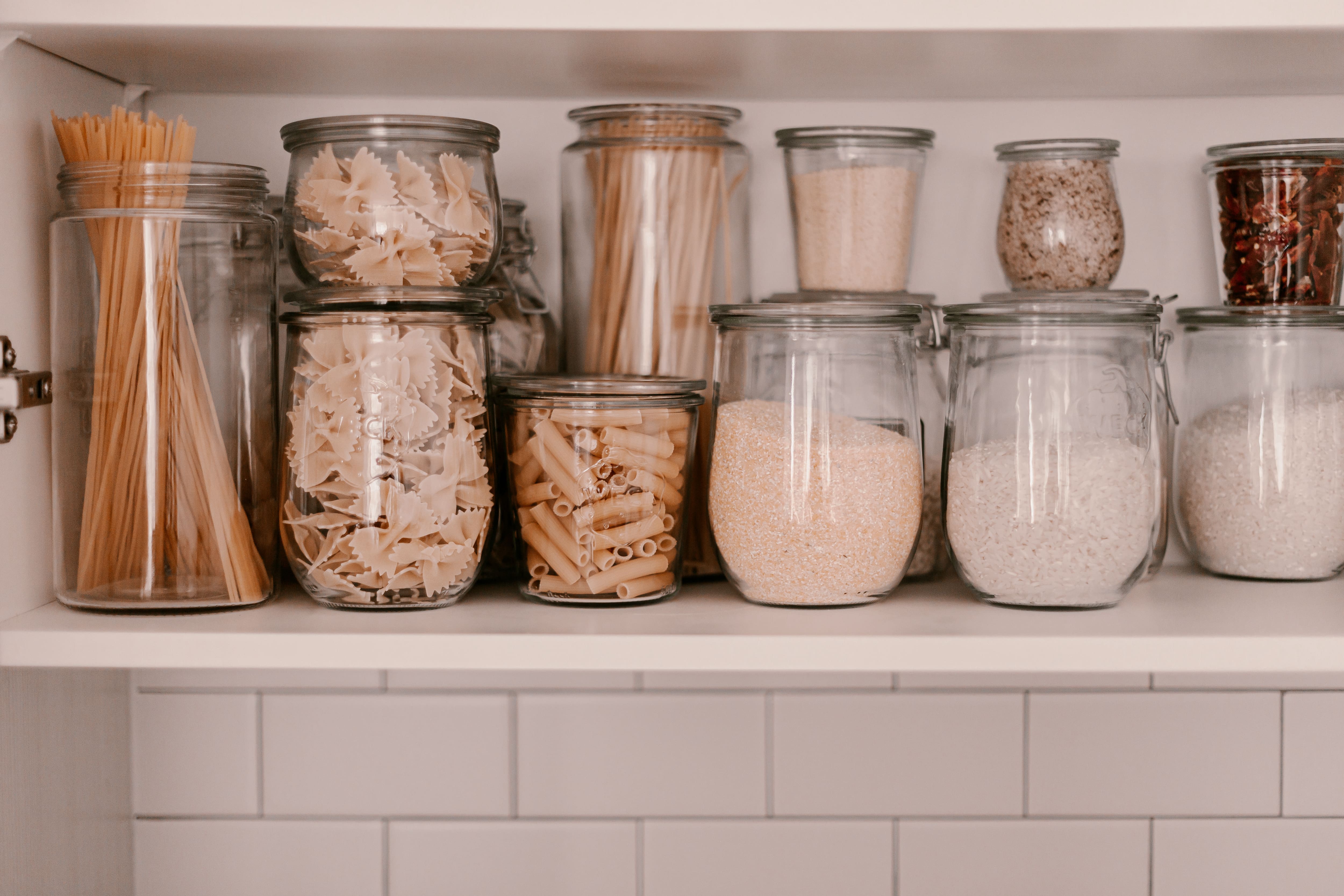 Small and large jars in kitchen pantry