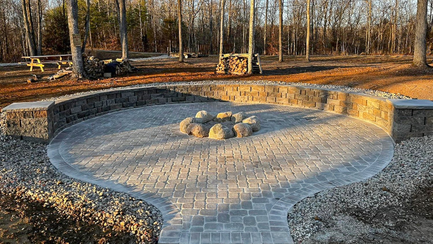 Paver patio with a fireplace