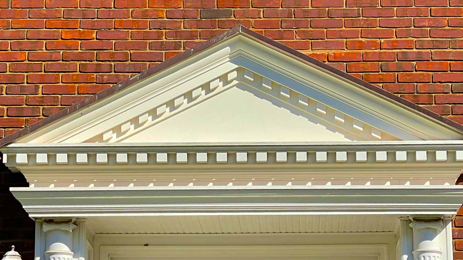 Pediment above door on house