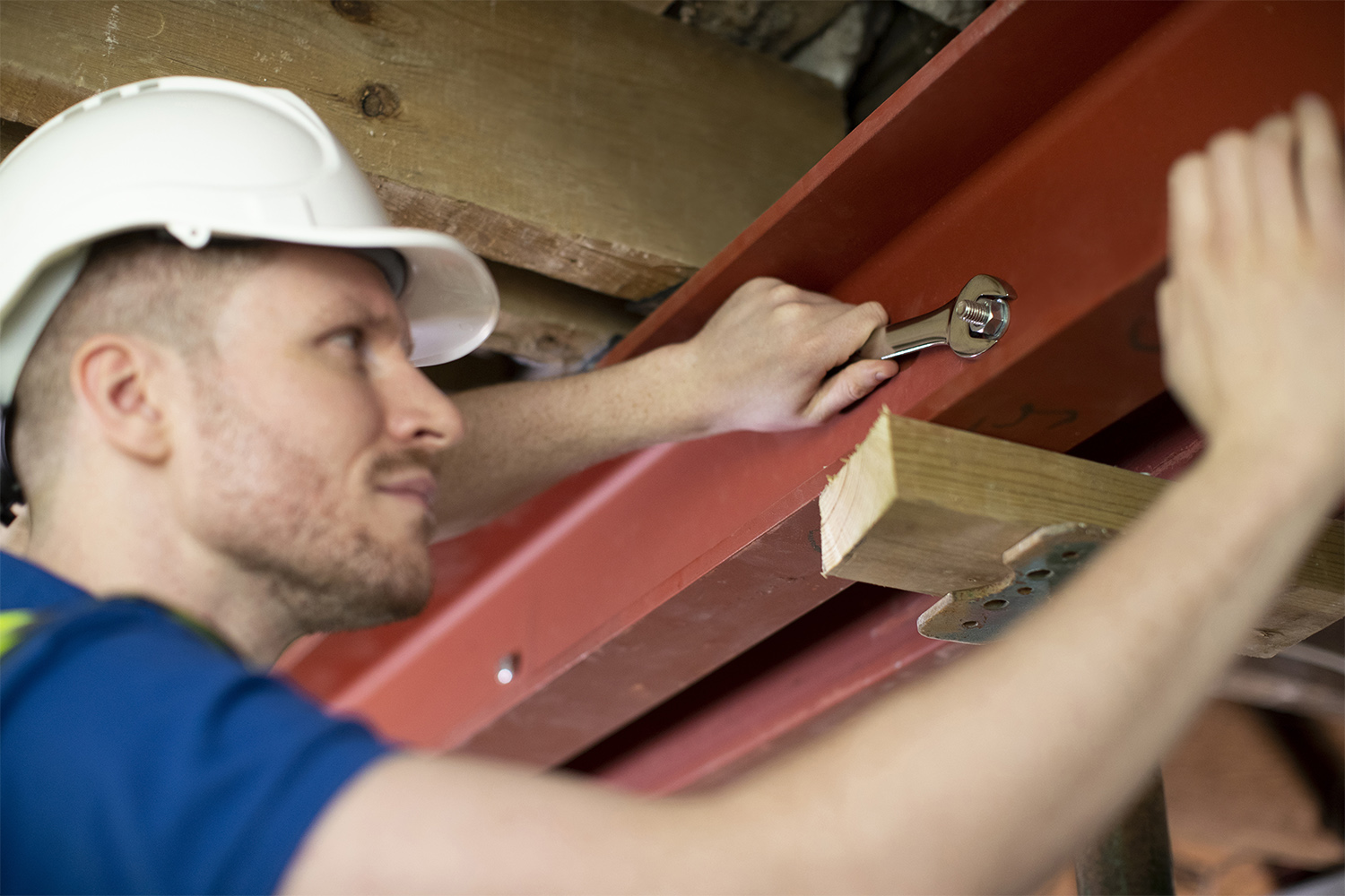 Person fixing steel support beam