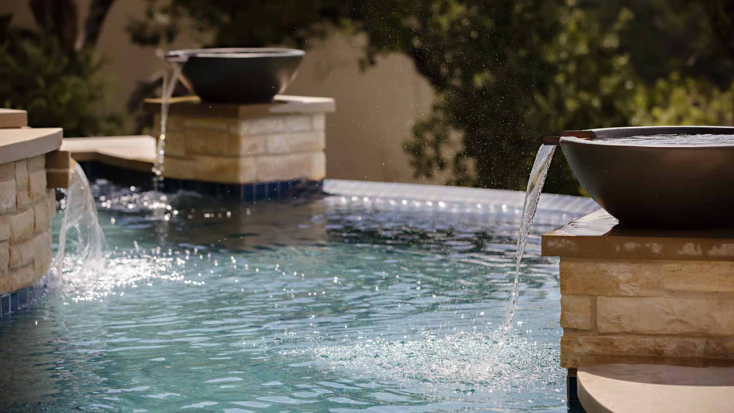 Pool with water fountain bowls