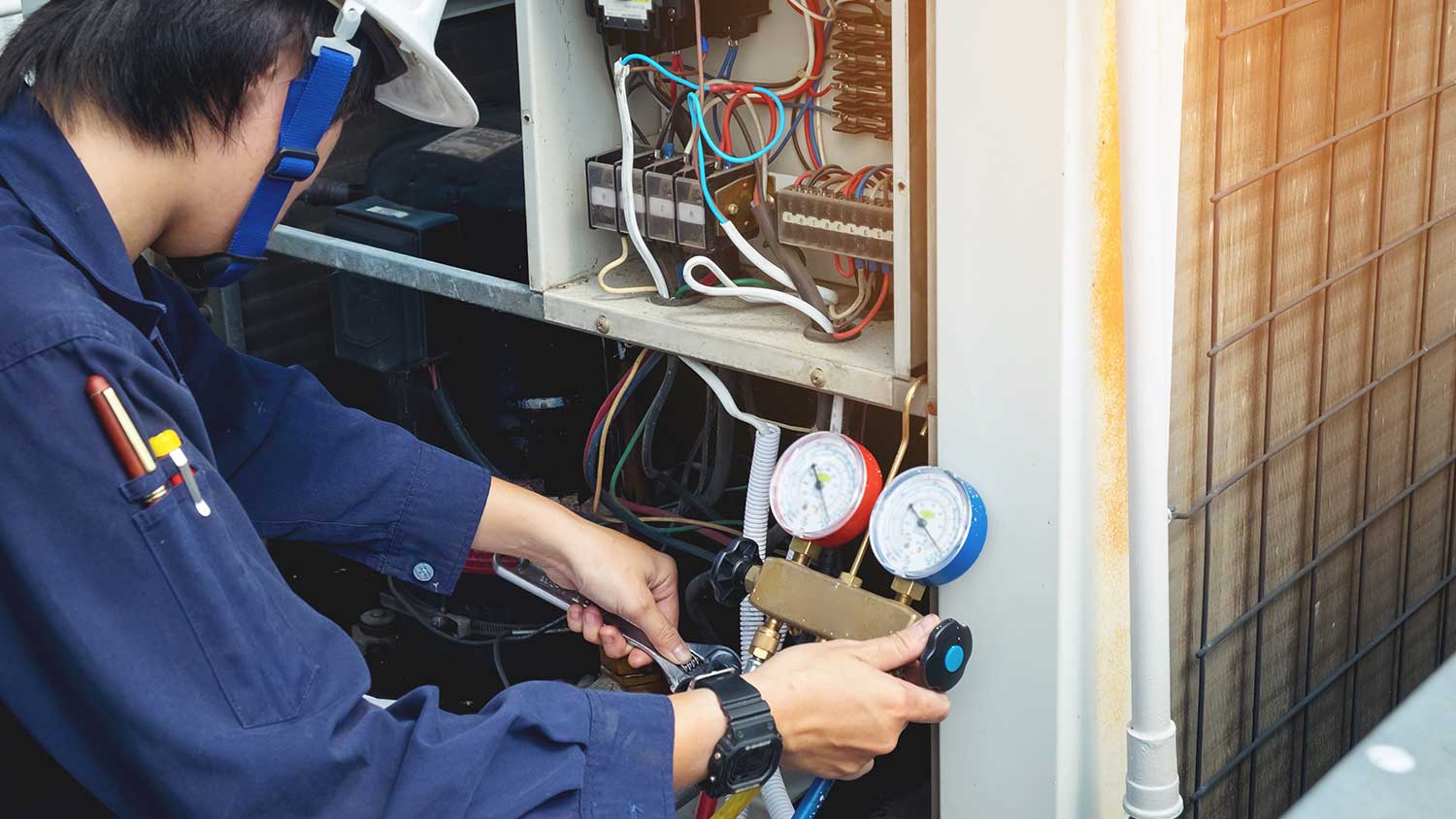 Professional checking ac unit to repair it