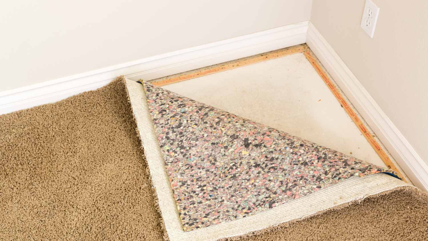 Pulled back carpet and padding