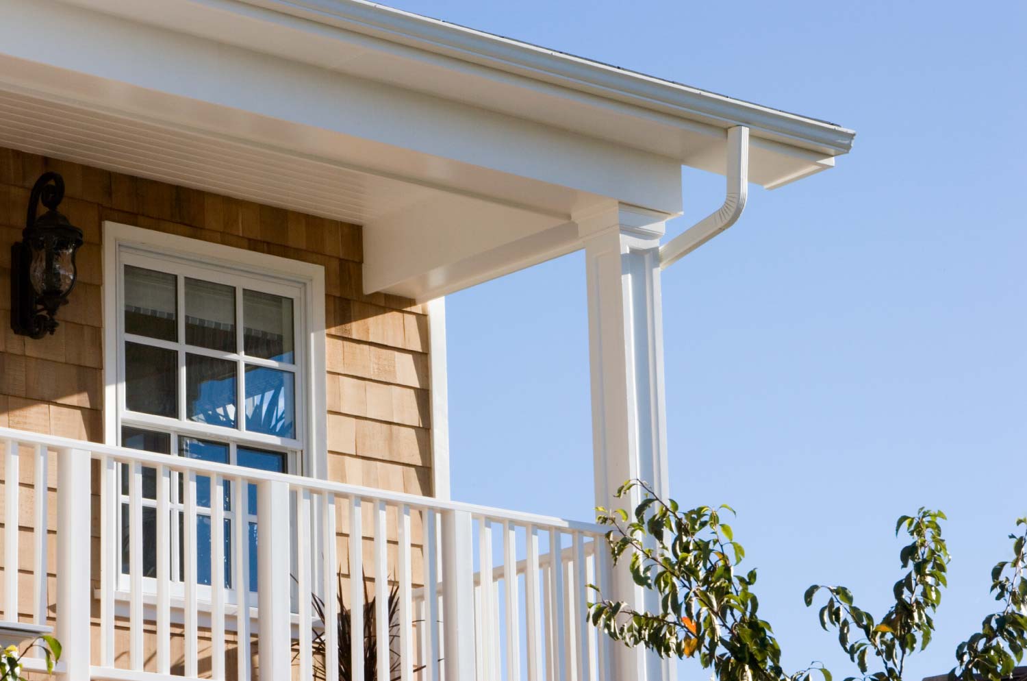 A close up of a vinyl gutter system