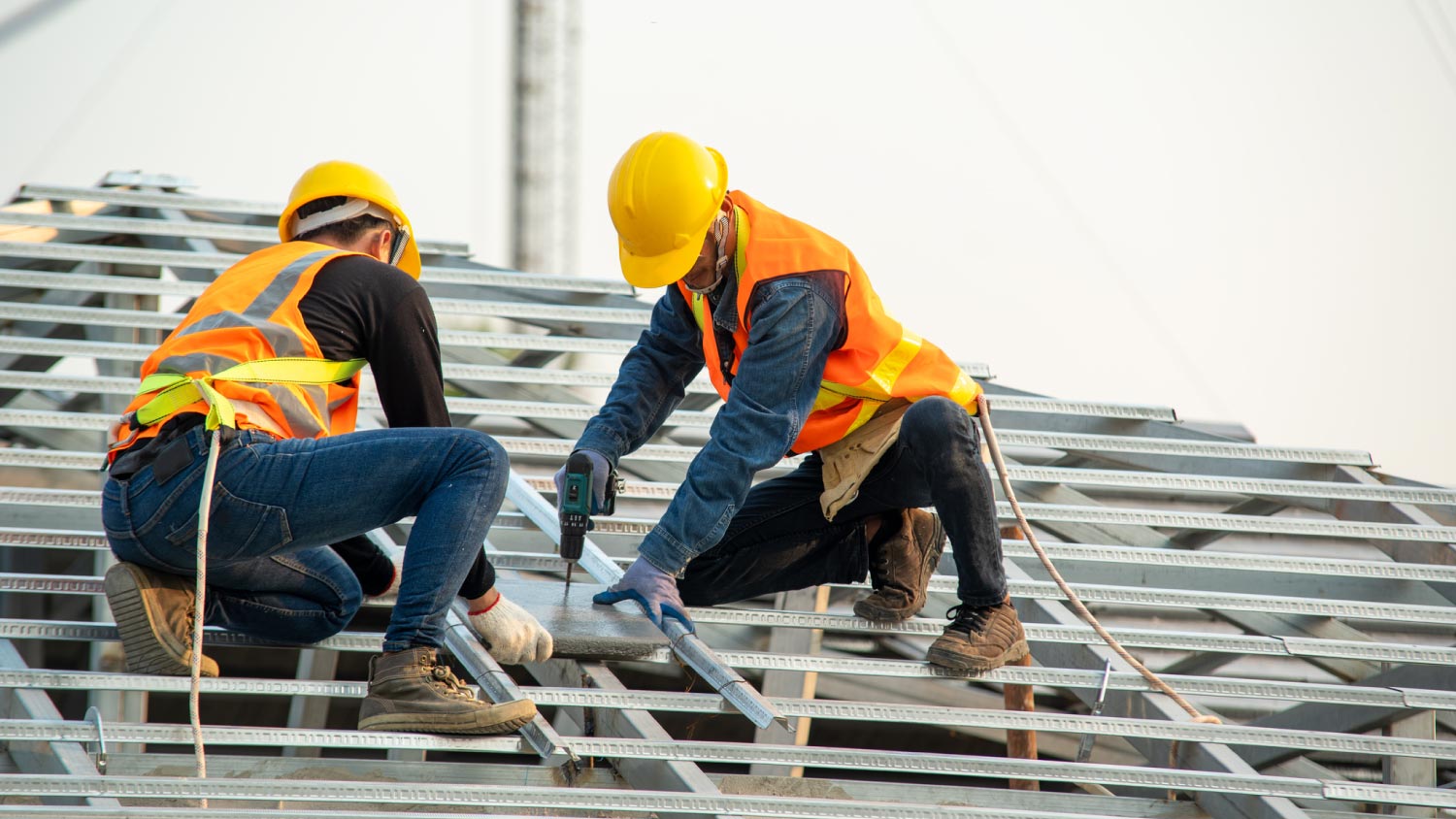 Roofers installing new roof