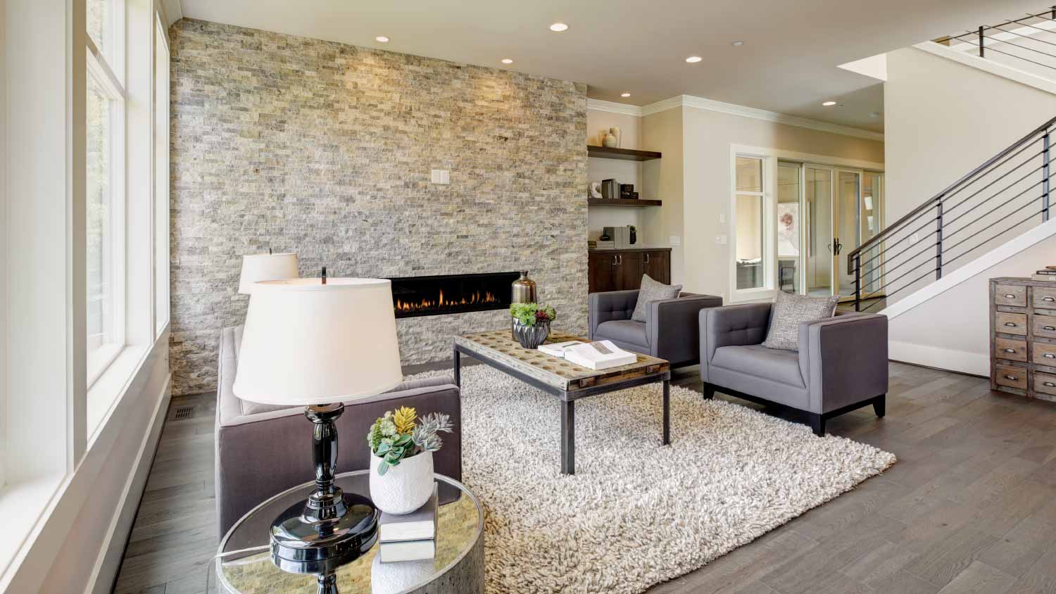 Room with ceiling stone fireplace