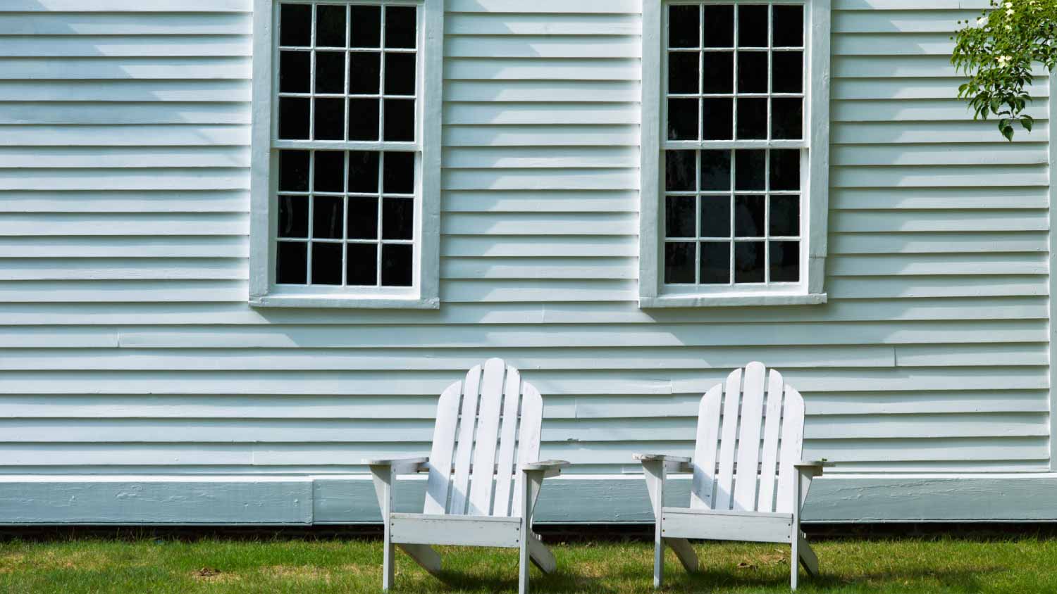 Sky blue house and lawn chairs