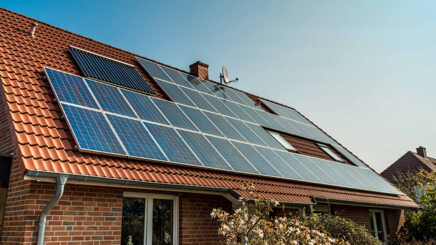 Solar panel on a red roof