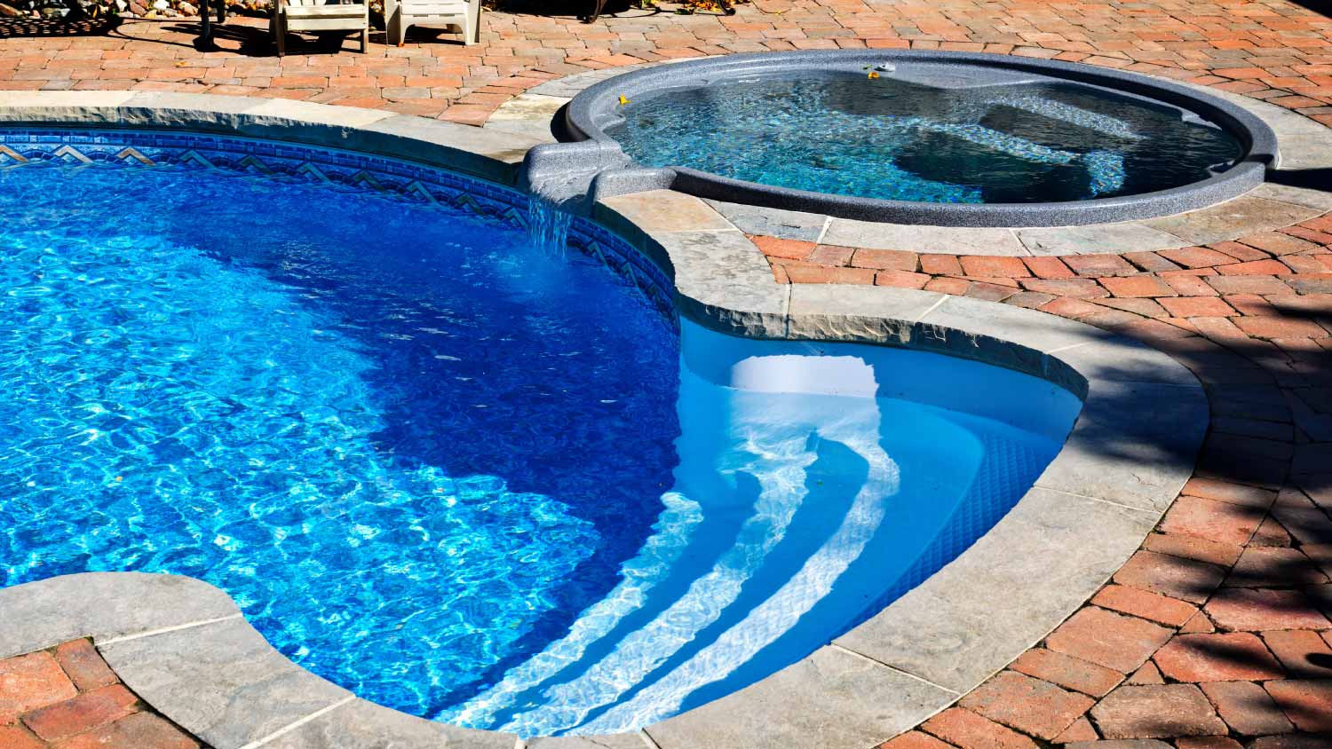 Swimming pool with hot tub