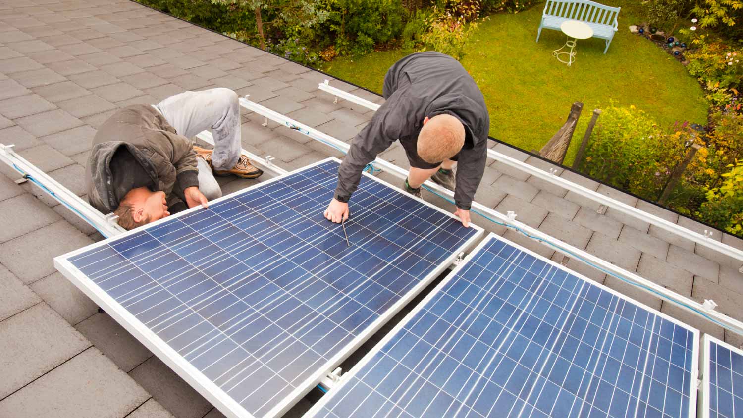 Technicians fitting solar photo