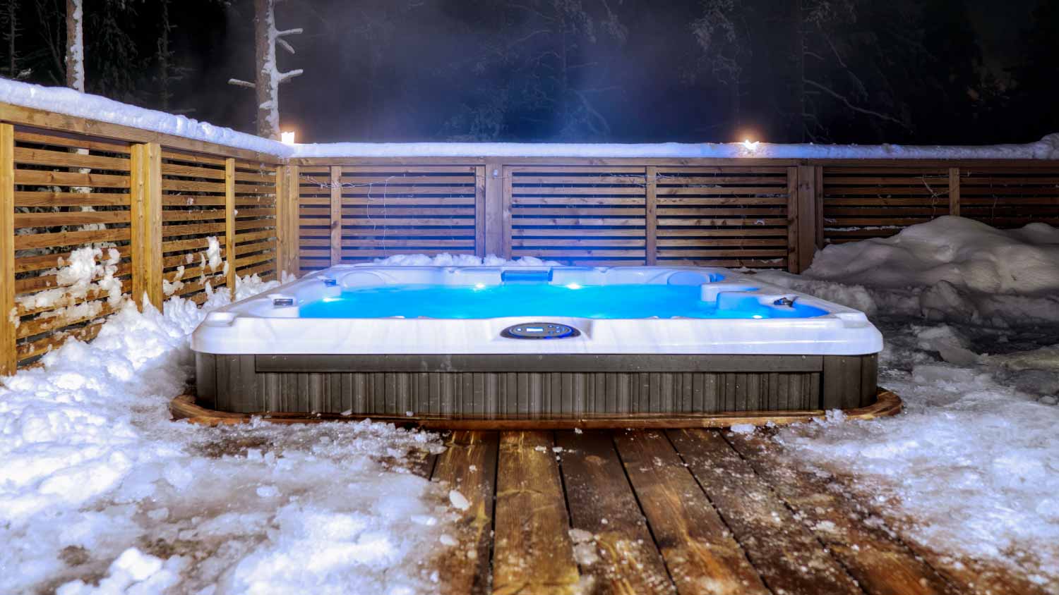 Warm hot tub winter landscape