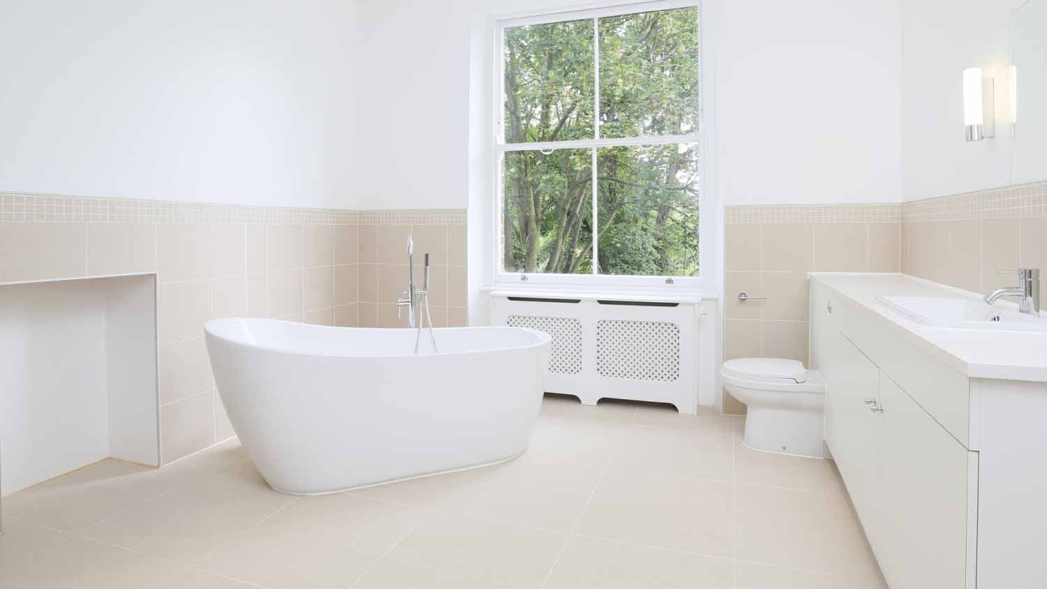 White bathroom with a bathtub