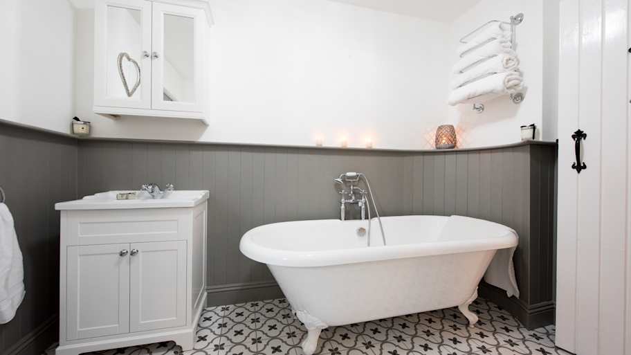 White bathroom with free standing bath