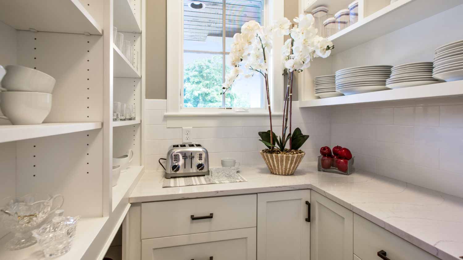 White cabinets and shelves in pantry room