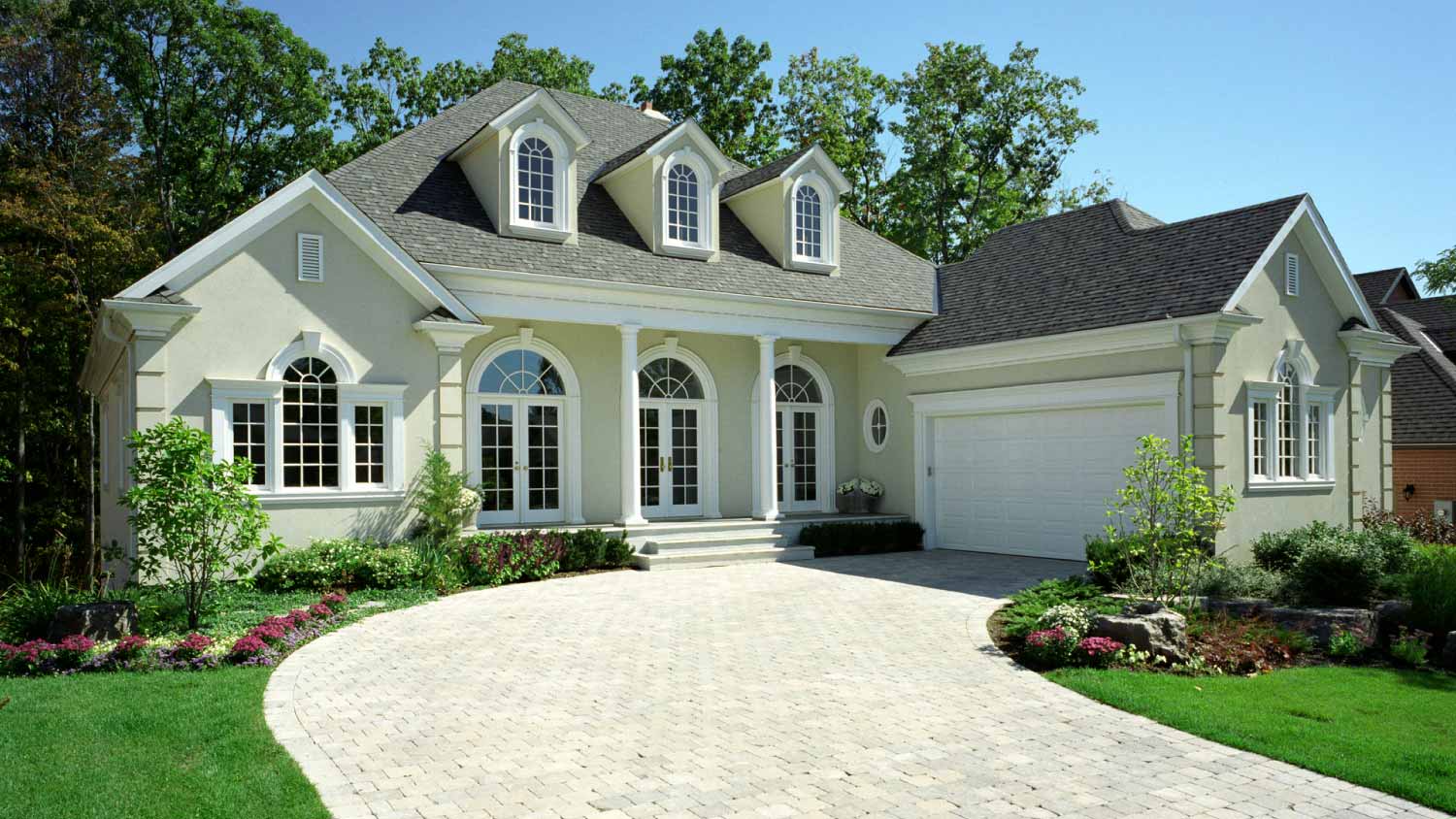 White house exterior with a driveway