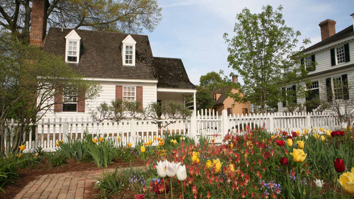 White house with garden and flowers 