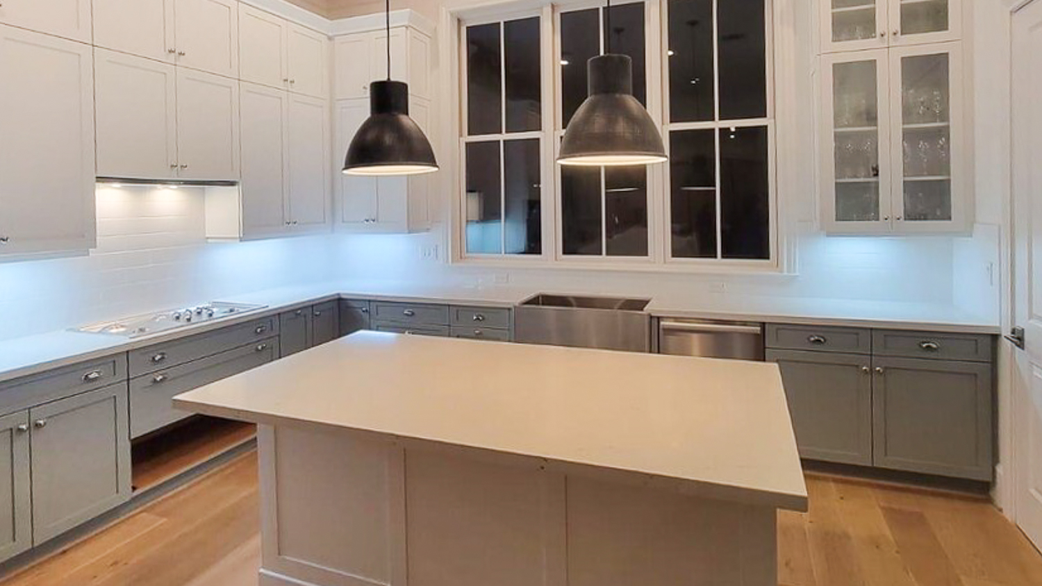 White kitchen with gray furniture 